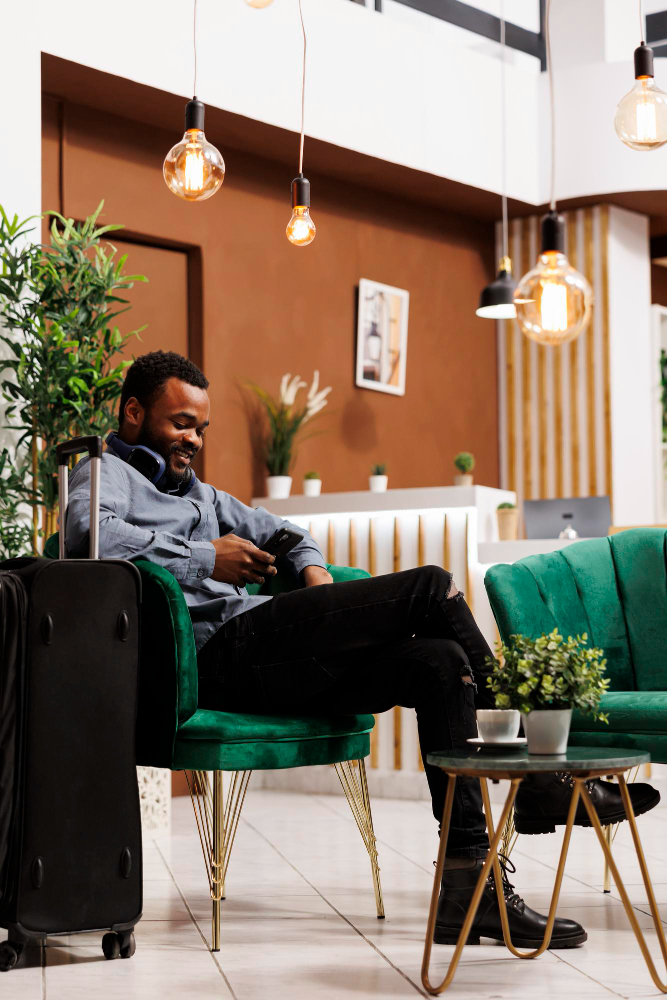African host welcoming a guest into a furnished short-stay property